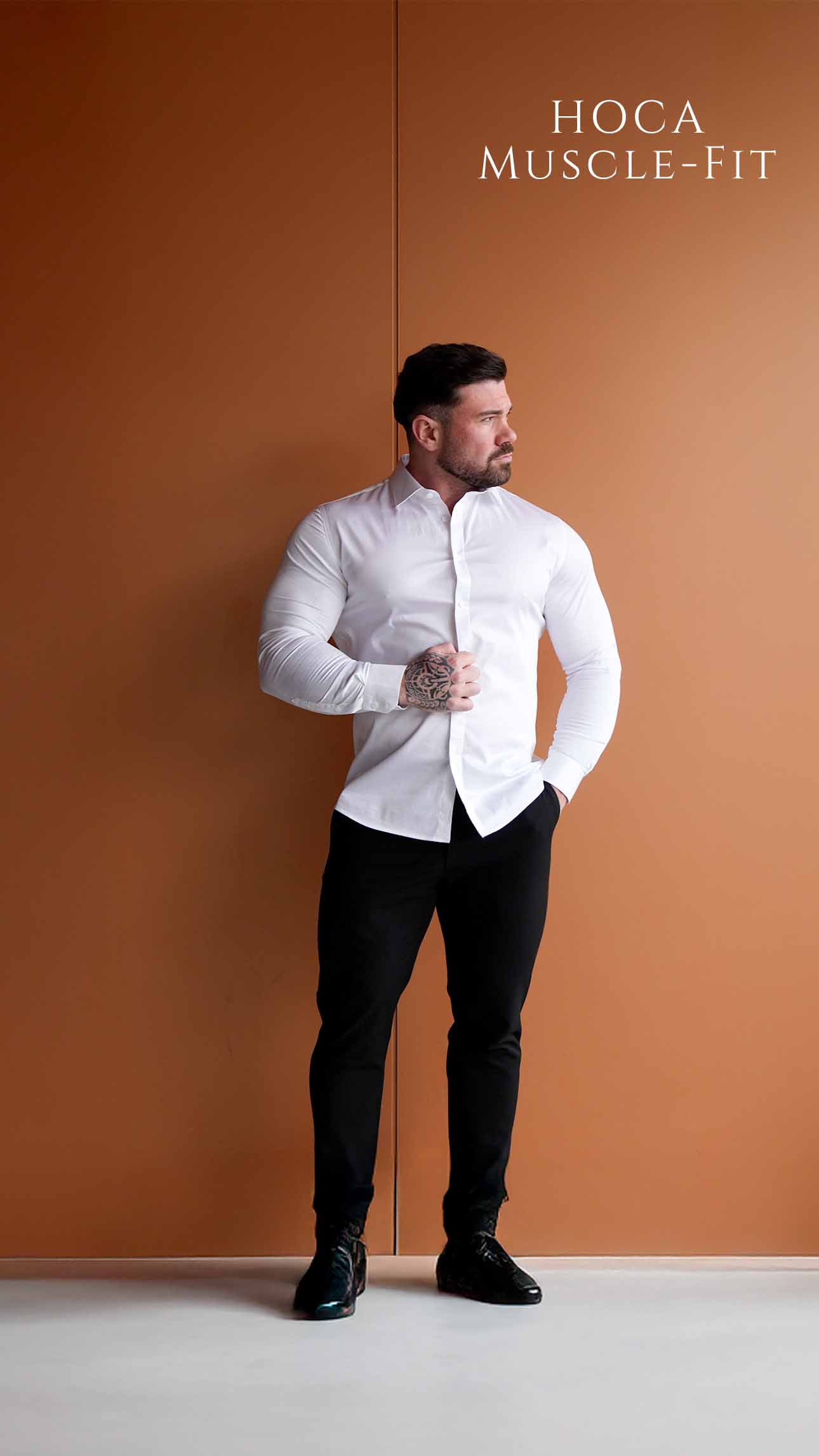 Men is wearing a white muscle-fit shirt.