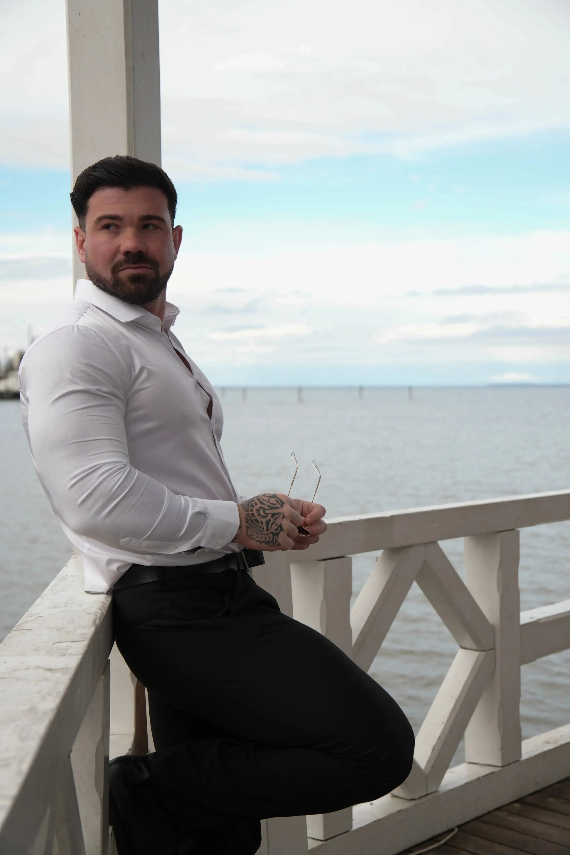 Men is wearing a white Muscle-Fit Shirt.